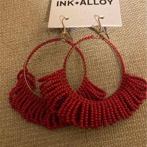 Pretty red beaded earrings by ink and alloy, never worn